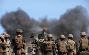 Members of the 3rd Marine Littoral Regiment fire an M-777 howitzer during a Balikatan drill at the La Paz Sand Dunes in Laoag, Philippines, May 6, 2024.