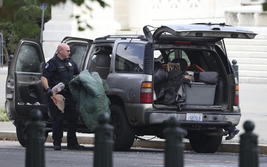 Members of U.S. Capitol Police investigate a suspicious vehicle outside the U.S. Supreme Court on Tuesday, Oct. 5, 2021, on Capitol Hill in Washington, D.C. 