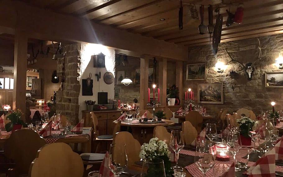 The interior of the Swiss House restaurant in Bad Duerkheim, Germany, features numerous charming Swiss mountain motifs.