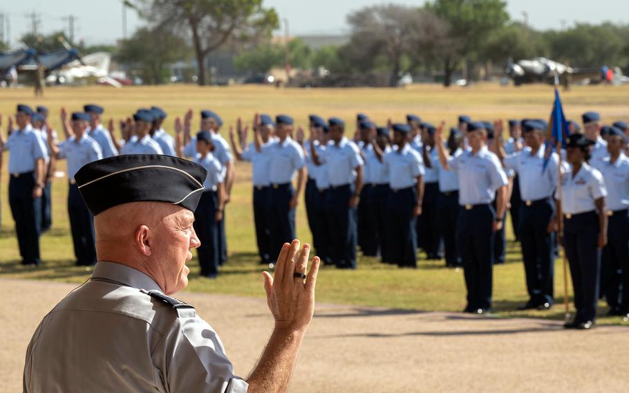 Air Force Gen. John “Jay” Raymond gives the oath of enlistment to basic training graduates at Joint Base San Antonio-Lackland, Texas, on June 23, 2022.