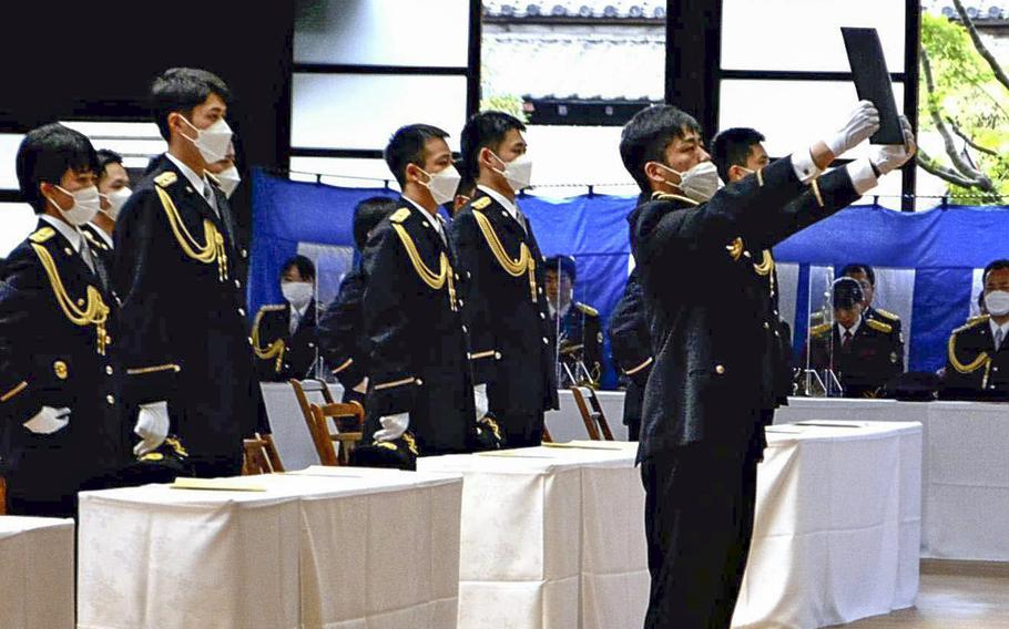 Takashi Asahata, a representative of the graduates, makes a speech at the graduation ceremony of the Imperial Guard Headquarters’ school. 