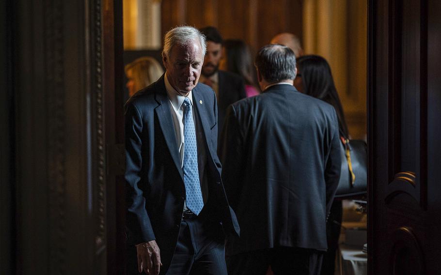 Sen. Ron Johnson, R-Wis., leaves a GOP luncheon in March 2022.