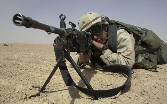 Camp Coyote, Kuwait, Mar. 13, 2003: Lance Cpl. Jose Nunoz aims in with his M-249 Squad Automatic Weapon during immediate action drills and mock assaults on enemy formations near Camp Coyote, Kuwait.

META TAGS: Kuwait; USMC; U.S. Marine Corps