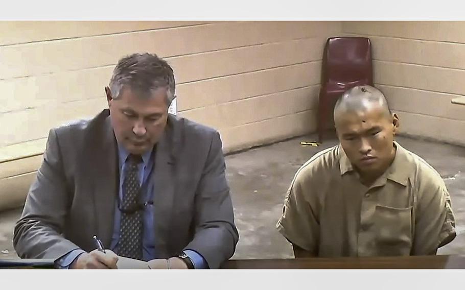 A video screen grab shows Army Spc. James Kelly making his first court appearance on Wednesday, June 21, 2023. At left, is Kelly’s lawyer.