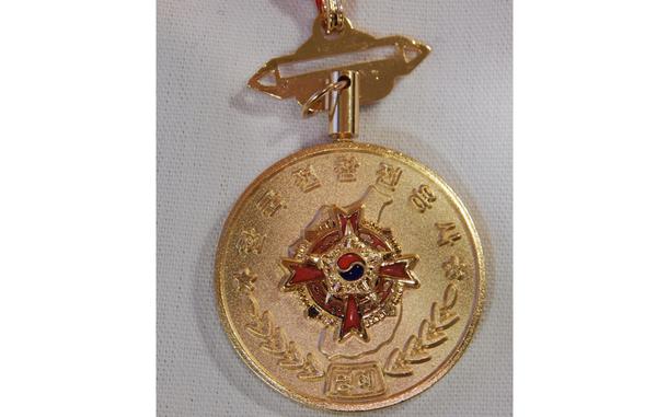 A close-up of a gold medal.