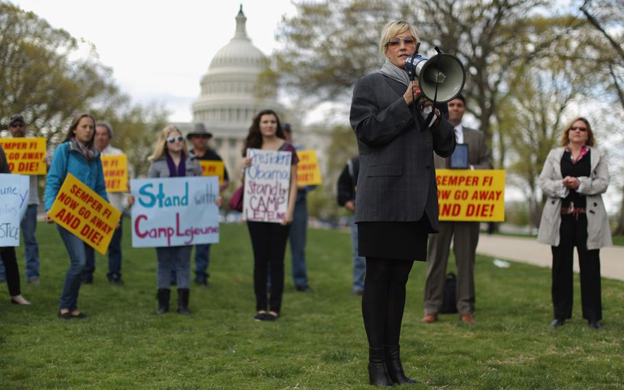 Consumer advocate Erin Brockovich addresses a rally against the federal government's support for what they say is a known polluter on Capitol Hill, April 23, 2014, in Washington, D.C.