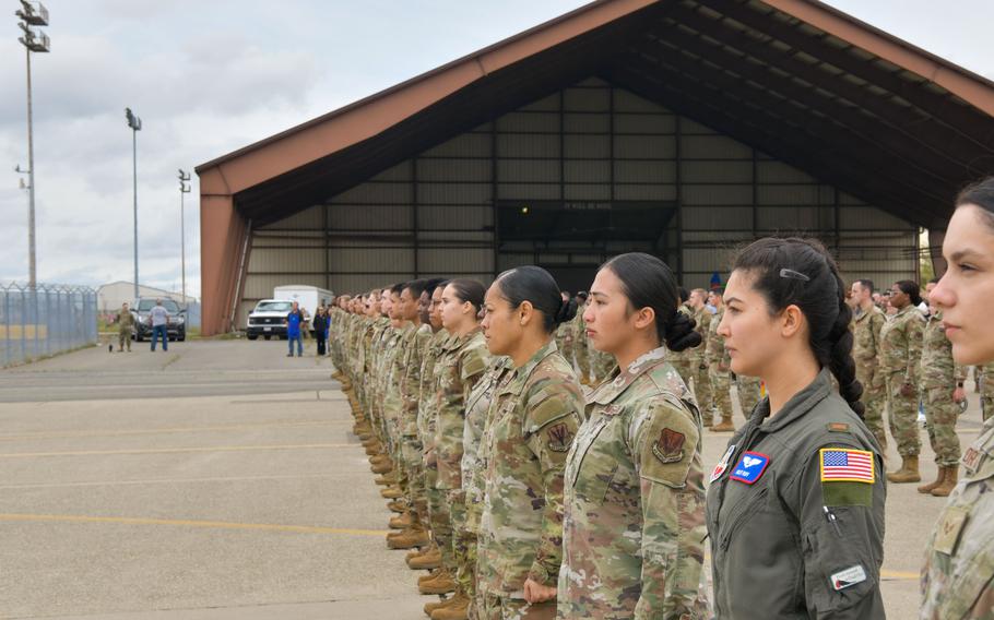 Airmen stand at attention