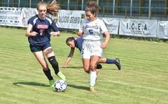 Sigonella's Charlize Caro and Aviano's Kylee Moncur battle for the ball in an April contest in Aviano, Italy. The Jaguars and Saints open their respective Division III and Division II European soccer championship tournaments on Monday in Germany.