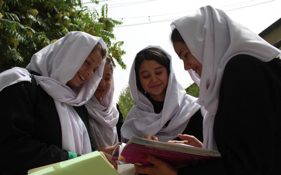 From left, the three members of the Best Friend Group at Zarghoona High School: Belqees Niazi, 17, Behishta Amini, 18, and Safia Hussain, 18, with an unidentified girl second from left. 