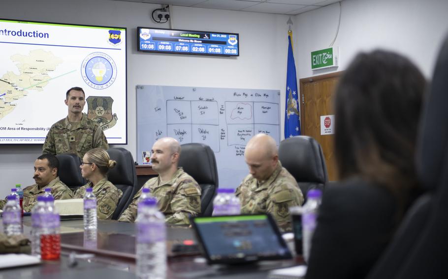 U.S. Air Force Lt. Col. David Tubman, 386th Expeditionary Medical Squadron clinical psychologist, talks about Task Force 99.M at a briefing at Ali Al Salem Air Base, Kuwait, Nov. 21, 2022, that included Schuyler Moore, U.S. Central Command chief technology officer. The task force aims to find ideas from airmen that will improve the force.