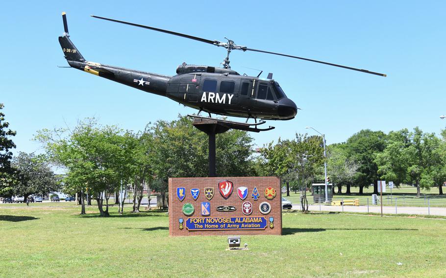 A helicopter is displayed above a gate sign for Fort Novosel.