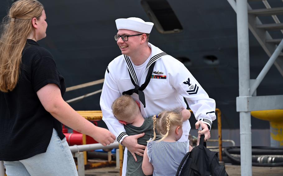 A sailor greets his family upon the USS Blue Ridge’s return to Yokosuka.