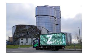 A truck displaying the symbols "Z" in support of the Russian armed forces involved in a military conflict in Ukraine is parked outside PMC Wagner Centre, which is a project implemented by the businessman and founder of the Wagner private military group Yevgeny Prigozhin, during the official opening of the office block in Saint Petersburg, Russia, November 4, 2022. REUTERS/Igor Russak/ File Photo