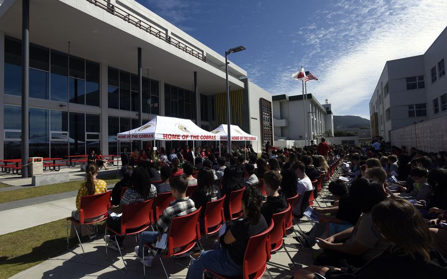 Students, teachers and officials from the Navy and Department of Defense Education Activity attend a ribbon-cutting ceremony for E.J. King Middle and High School at Sasebo Naval Base, Japan, Wednesday, Sept. 21, 2022. 