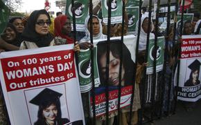 People rally demanding the release of Aafia Siddiqui, who was convicted in February 2010 of two counts of attempted murder, and who is currently being detained in the U.S. during International Women's Day in Karachi, Pakistan, Tuesday, March 8, 2011. The man who authorities say was holding hostages inside a Texas synagogue on Saturday, Jan. 15, 2022, demanded the release of Aafia Siddiqui, a Pakistani woman who is imprisoned on charges of trying to kill American service members in Afghanistan. 