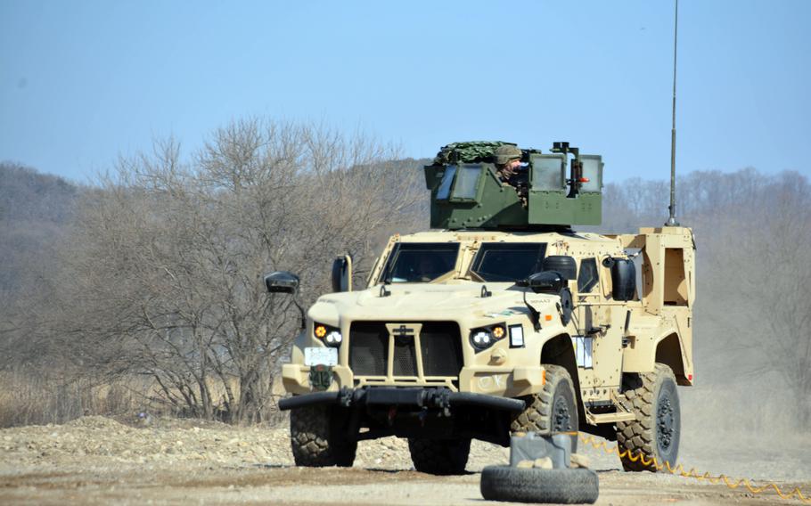 Marines simulate a battle during a convoy operation at Dagmar North Training Area in Paju, South Korea, Tuesday, Feb. 21, 2023.