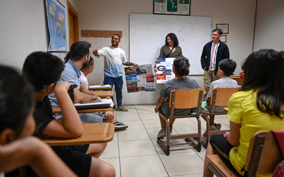 Airmen from the 39th Air Base Wing at Incirlik Air Base in Turkey give a presentation on American culture Aug. 23, 2022, to English language learners in Adana, Turkey. Airmen began visiting students in February 2022 to enhance cultural ties between the base and the surrounding community. The program is slated to resume in June after a pause prompted by devastating earthquakes in February.