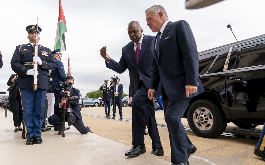 Secretary of Defense Lloyd Austin greets Jordan’s King Abdullah II bin Al-Hussein during an honor cordon at the Pentagon in Washington, Thursday, May 12, 2022.