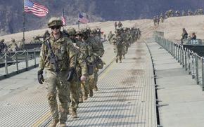 FILE - U.S. Army soldiers cross a floating bridge on the Imjin River during a joint river-crossing exercise between South Korea and the United States as a part of the Freedom Shield military exercise in Yeoncheon, South Korea, March 20, 2025. (AP Photo/Ahn Young-joon, File)
