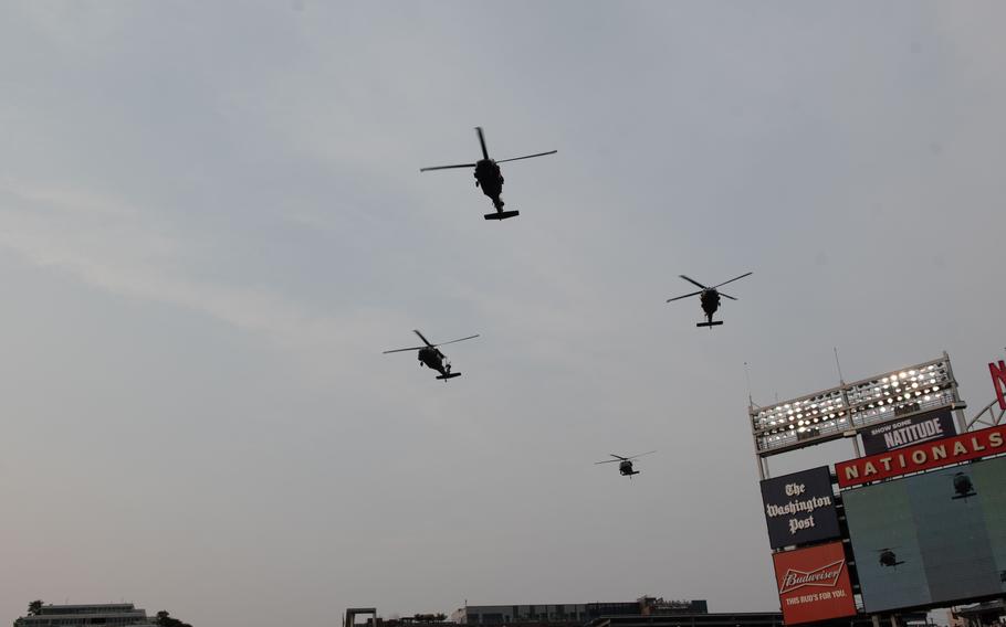 Four UH-60 Black Hawks from the 12th Aviation Battalion, The Army Aviation Brigade perform a flyover during U.S. Army Day at Nationals Park in Washington, D.C., on Friday, June 16, 2023. The Nationals hosted the Miami Marlins.