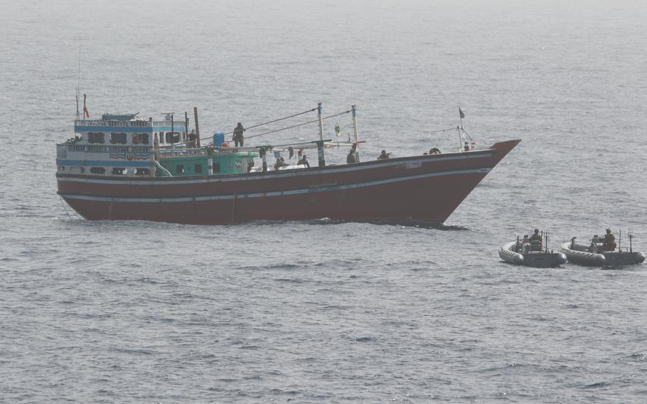 An interdiction team from the destroyer USS Momsen approaches a fishing vessel May 16, 2022. The vessel was seized in international waters in the Gulf of Oman.