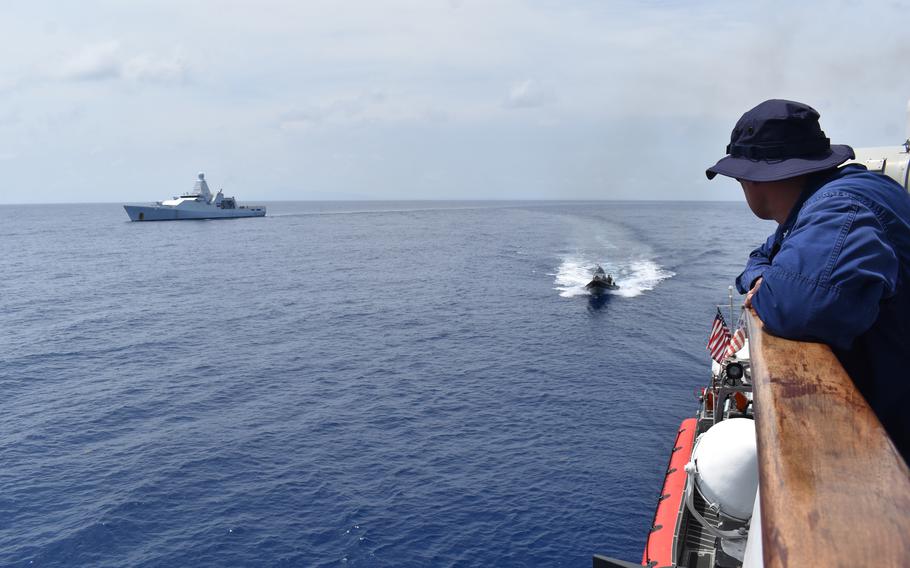 Cmdr. Mike Ross, commanding officer of Coast Guard Cutter Resolute (WMEC 620), oversees a bulk contraband transfer with the Royal Netherlands Navy HNMLS Groningen (P843) in the Caribbean Sea, May 20, 2024. 