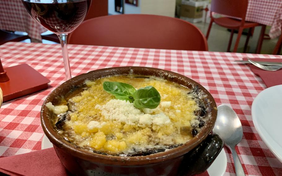 An eggplant dish sits on a table at a restaurant in Naples, Italy