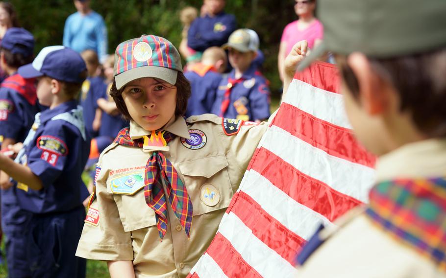 Cub Scouts with Yokosuka Pack 33 take part in a flag retirement ceremony at Ikego West Valley Campground near Yokosuka Naval Base, Japan, May 6, 2023.