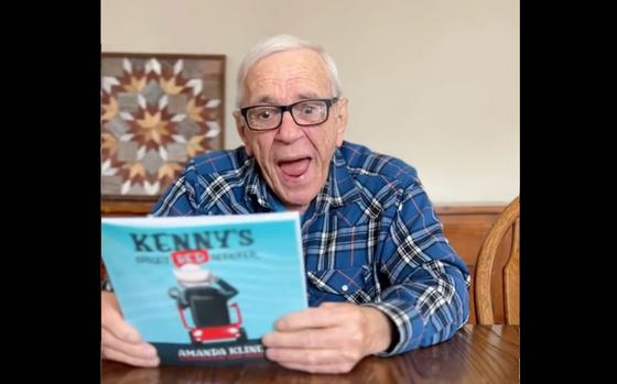 Navy veteran Kenny Jary, 81, looks at "Patriotic Kenny’s Bright Red Scooter" for the first time in this screenshot from his TikTok account, @PatrioticKenny