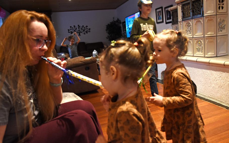 A Ukrainian mom celebrates the birthday of her nephew with her twin daughters, March 16, 2022, while staying with an American host family near Ramstein Air Base, Germany, after fleeing the war in Ukraine. Twenty-seven families, mostly Americans, are currently hosting more than 60 Ukrainian refugees, most in the Kaiserslautern area, with help from the group Operation Ukrainians to Ramstein.