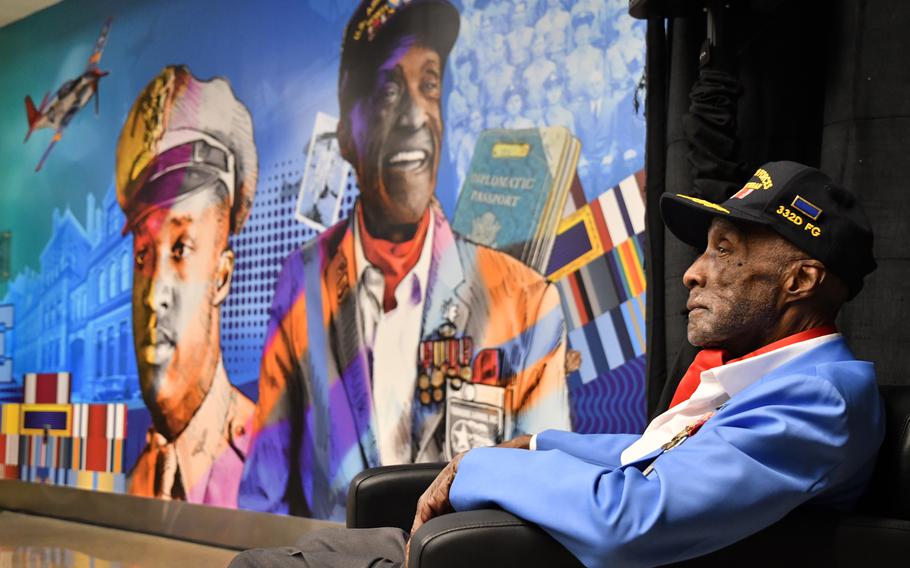 Tuskegee Airman Enoch O’Dell “Woody” Woodhouse II with the mural honoring him that was unveiled at terminal C in Logan Airport October 3, 2022 in Boston. 