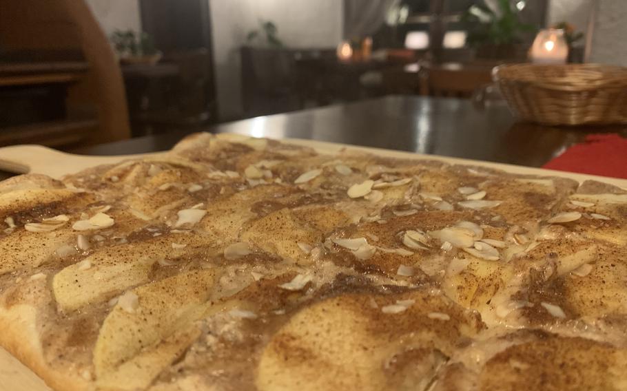 A piping hot apple flammkuchen as served up Jan. 14, 2022, at Nora Restaurant, a little nook in downtown Kaiserslautern specializing in the pizza-like Alsatian dishes and friendly service.