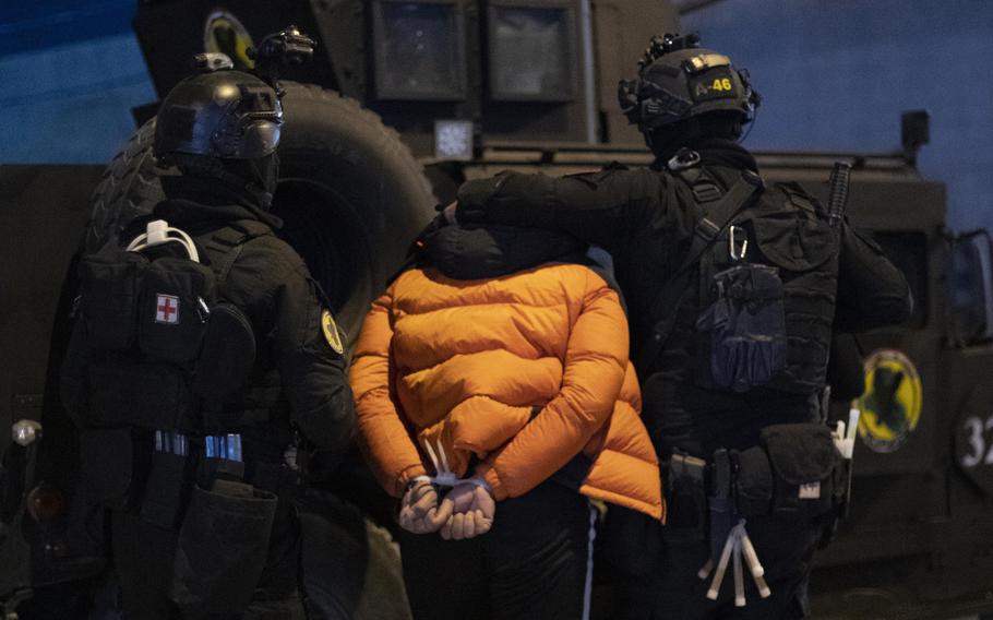 120p na               Shaker al-Issawi, also known as Abu Waheeb, a man suspected to be a former member of the Islamic State, is taken into custody in Fallujah, Iraq, on Jan. 17, 2021. MUST CREDIT: Photo for The Washington Post by Charles Thiefaine