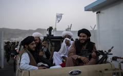Taliban fighters sit in a pickup truck at the airport in Kabul, Afghanistan, Thursday, Sept. 9, 2021. Some 200 foreigners, including Americans, flew out of Afghanistan on an international commercial flight from Kabul airport on Thursday, the first such large-scale departure since U.S and foreign forces concluded their frantic withdrawal at the end of last month. (AP Photo/Bernat Armangue)