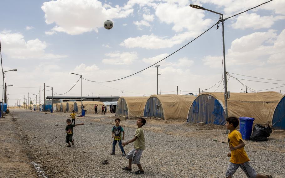 Children play soccer in the Jeddah camp. 