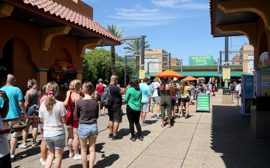 Visitors line up at Busch Gardens in Tampa, Florida, in June 2021. The park has a Quick Queue pass that starts at $14.99 to skip the line at least once per ride and up to $39.99 for unlimited rides, plus the new Iron Gwazi coaster. 
