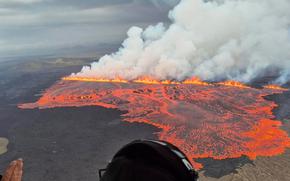 Smoke, flames and lava viewed from above.