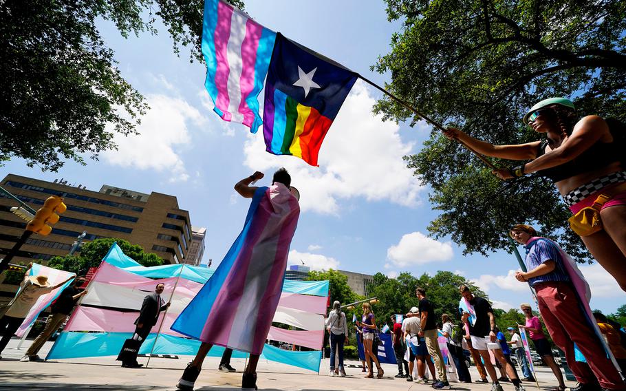 Demonstrators gather on the steps to the State Capitol to speak against transgender-related legislation bills being considered in the Texas Senate and Texas House, May 20, 2021, in Austin, Texas.