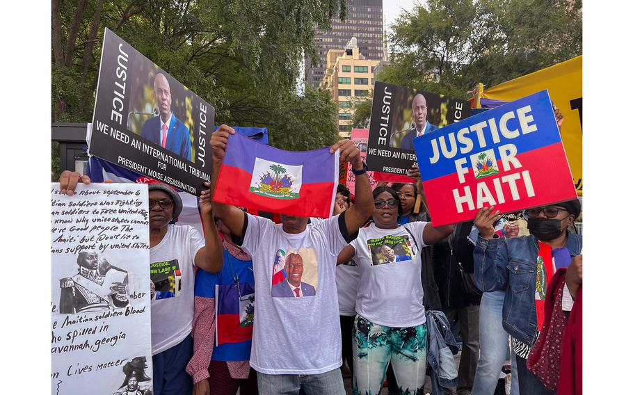 Supporters of assassinated Haitian President Jovenel Moïse hold a rally outside United Nations headquarters in New York City on Sept. 22, 2023. 