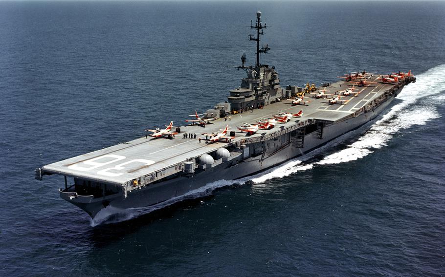 The aircraft carrier USS Antietam (CVS-36) is seen on April 19, 1961, operating with training aircraft. Planes on deck include North American T2J-1 Buckeyes amidships and forward and Douglas AD Skyraiders parked aft.