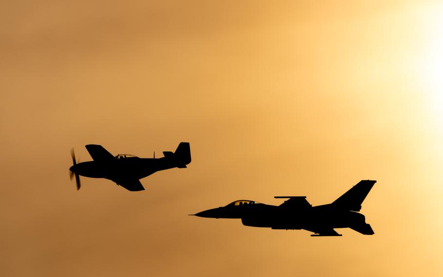 A vintage P-51 Mustang and a current U.S. Air Force F-16 Fighting Falcon cruise into the sunset during a heritage flight as part of the Thunder Over Louisville air show in Louisville, Ky., Saturday, April 20, 2024.