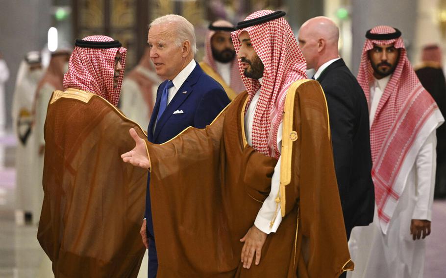 President Joe Biden and Saudi Crown Prince Mohammed bin Salman, center, arrive for a meeting at a hotel in Saudi Arabia’s Red Sea coastal city of Jeddah on July 16, 2022.