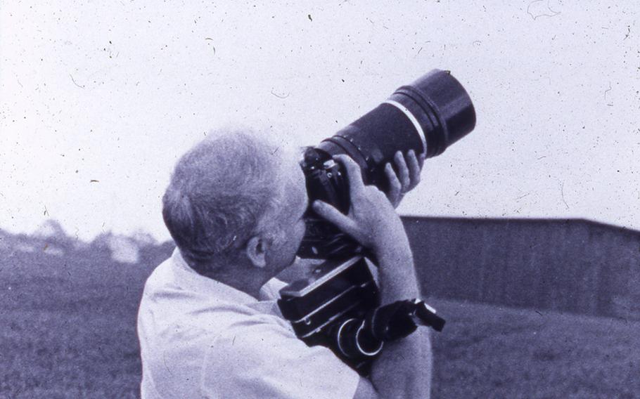 Retired U.S. Air Force Col. James Tonge is seen here snapping a photo during his time with the USMLM in Germany.