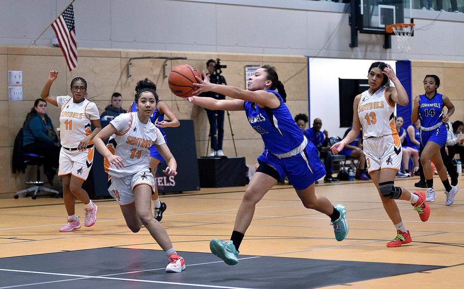 Hohenfels' Jalissa Jobity reahes out for a pass on the fast break while Sentinel Caleya Mortion defends during a basketball game on Jan. 26, 2024, at Spangdahlem High School in Spangdahlem, Germany.
