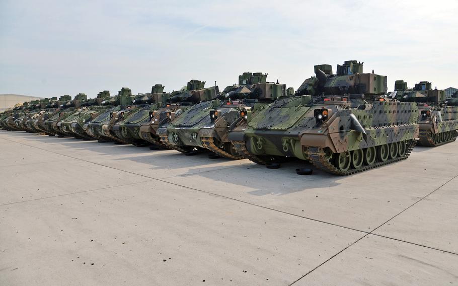 Rows of Bradley Fighting Vehicles sit in lines at Coleman Barracks in Mannheim, Germany, in 2017. A Defense Department Inspector General report released Feb. 27, 2023, found that when thousands of U.S.-based soldiers deployed to Europe last year some of the combat gear they pulled from storage depots wasn’t fully mission capable because of substandard maintenance.