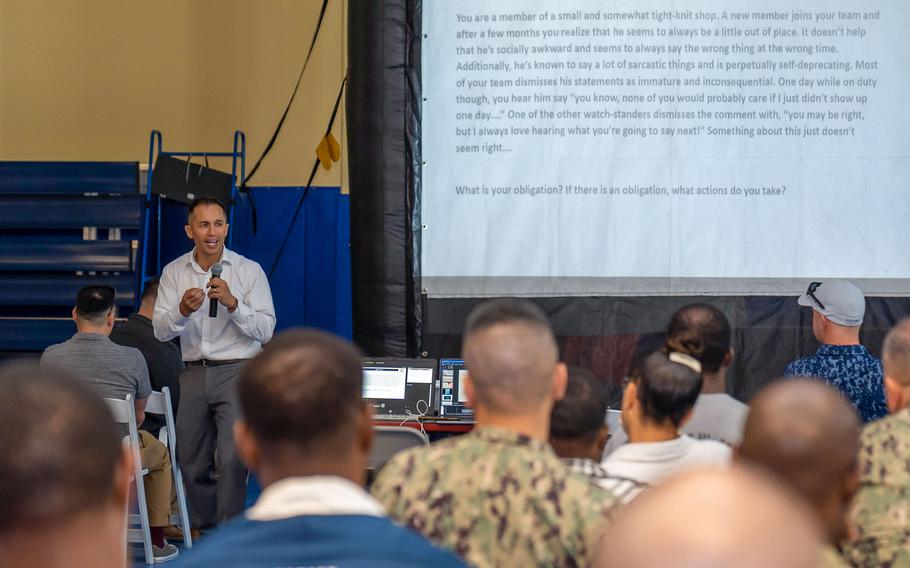 Cmdr. Anthony Baker, a Naval Forces Central Command chaplain, speaks April 12, 2023, at a mental health awareness event in Bahrain. Personnel deployed to Bahrain began a two-day stand-down intended to increase awareness of and access to mental health services at the base.