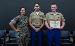 Marines pose for a photo.