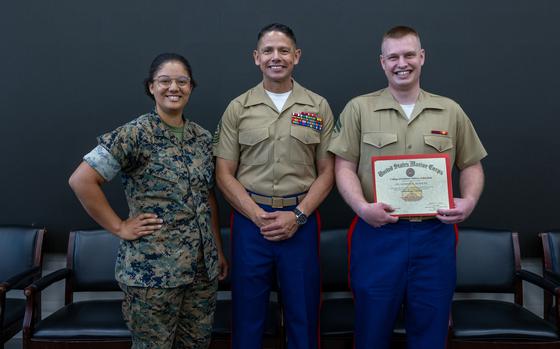 Marines pose for a photo.