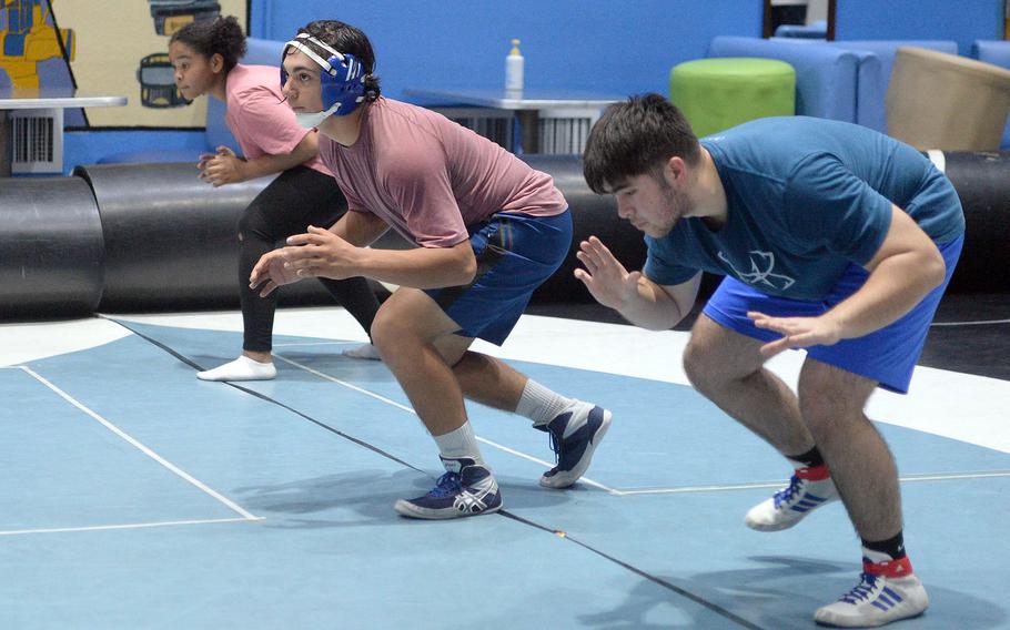 Sophomore Martin Heffele, middle, was the lone high school-aged wrestler out for Osan the first week of tryouts.