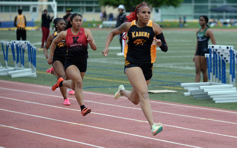 Despite leg cramps, Kadena senior Sharday Baker says she's hopeful she can beat her preliminary time of 12.65 in the 100.